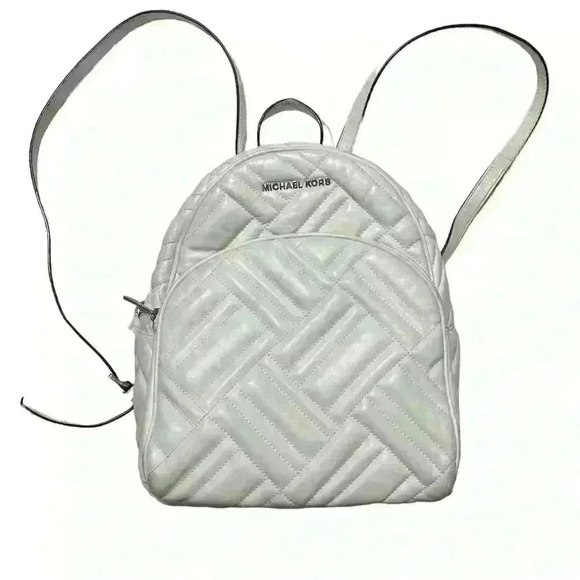 Michael Kors Handbags - Michael Kors Abbey white quilted backpack. Silver hardware. Two zipper pockets.